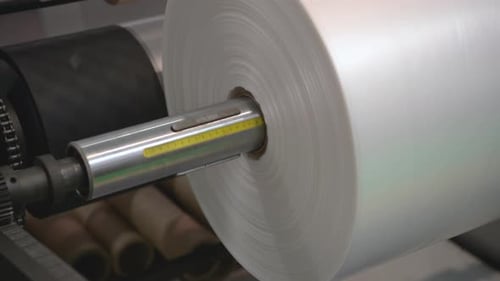 Tambour de réception et rouleaux d'alimentation de la machine d'extrusion