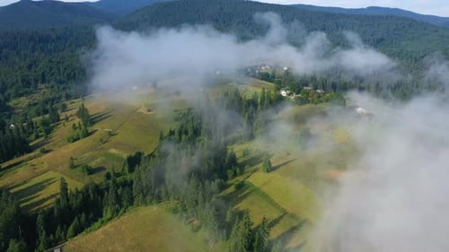 Morning Mountain Village Covered With The Clouds