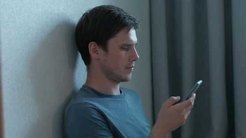 Man Use Smartphone at Home