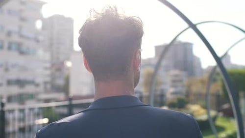 Back View Man Walking on the Street