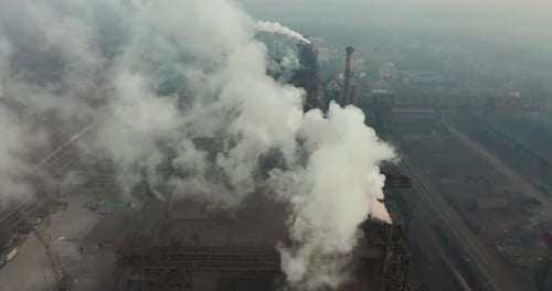 Top View of the Metallurgical Plant. Smoke Coming Out of Factory Pipes. Ecology