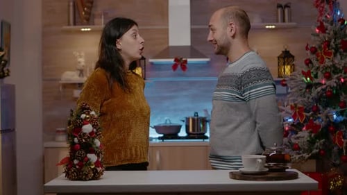 Couple Exchanging Gifts on Christmas at Home