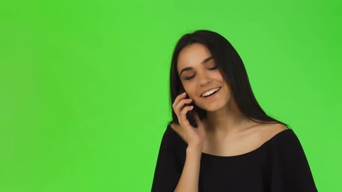 Woman Smiling During a Phone Call on Green Screen