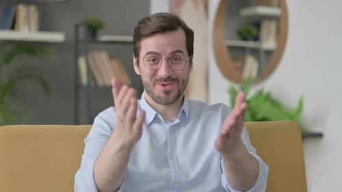 Man Speaking on Camera in Home Setting
