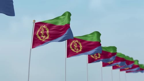 Realistic Eritrean Flags Waving Against a Bright Blue Sky
