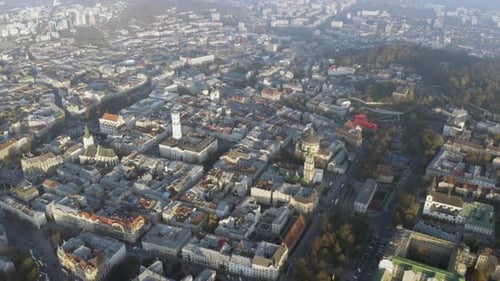 Flight Above the Roofs on Sunrise. Old European City. Ukraine Lviv City