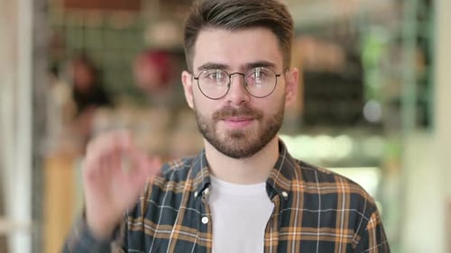Man Showing OK Hand Gesture with a Smile
