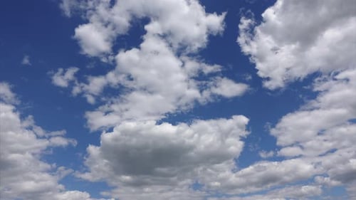 Fluffy White Clouds Time Lapse in Blue Sky