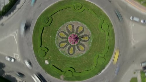 Aerial View Timelapse of Roundabout Road with Circular Cars in Small European City at Sunny Summer