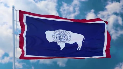 Realistic Wyoming State Flag Waving Against Blue Sky