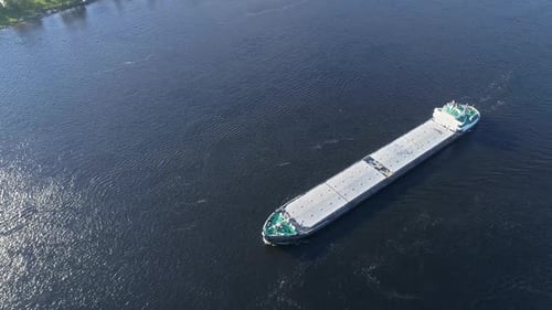 Aerial Top View of Cargo Ship Floating in River