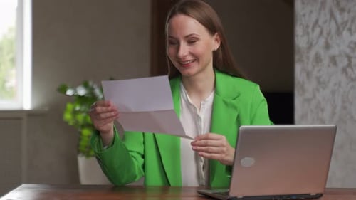 Happy Young Woman Reads Acceptance Letter From University