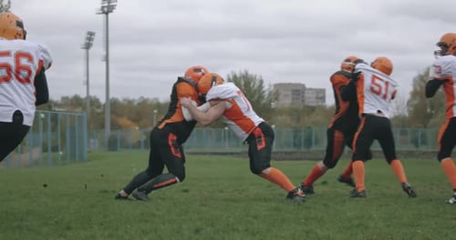 American Football Football Team in the Game the Player Catches Ball and Falls To the Ground Battle