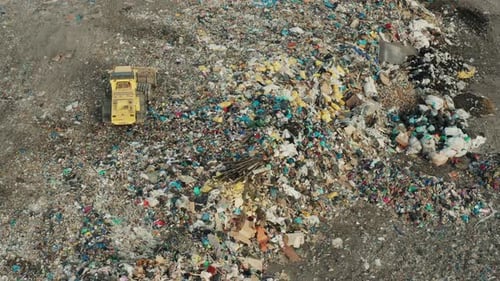 Aerial View of Large Landfill Site with Bulldozer