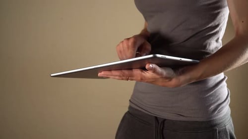Close Up Video of Woman Using Big Tablet at Home at Bight