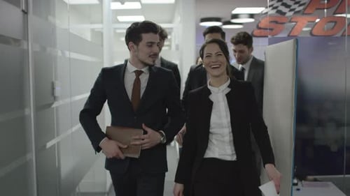 Happy people walking through the office building