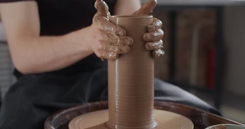 Potter Sculpts a Jug on a Potter's Wheel Video From Pottery Workshop Potter Makes Ceramics in Slow
