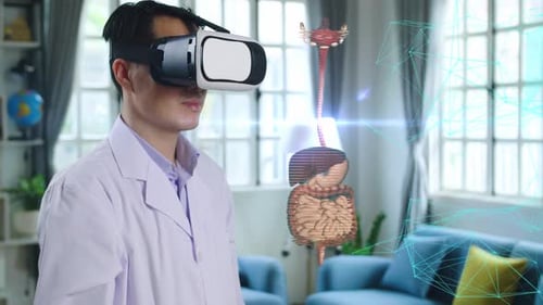 Man Using VR Headset Examining Digestive System Hologram