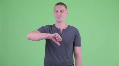 Young Adult Gives Thumbs Down on Green Screen