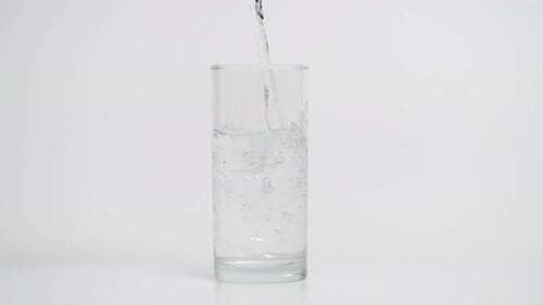 Water Being Poured Into a Drinking Glass