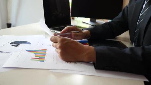 Businessman hands doing analysis planning business project in office.