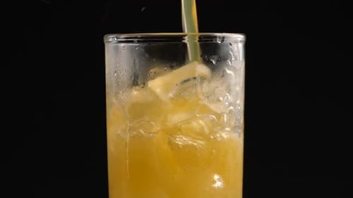 Refreshing Orange Soda Poured into Iced Glass