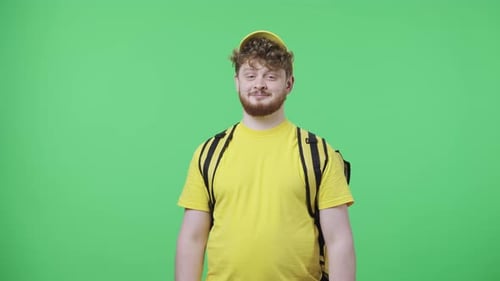 Delivery Man Offers Brown Paper Bag on Green Screen