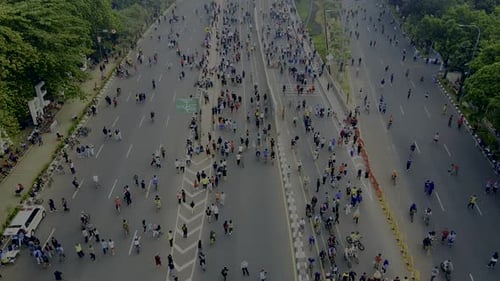 Aerial view. A crowd attends the car free day along street