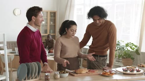 Friends Prepare Food Together in Bright Kitchen