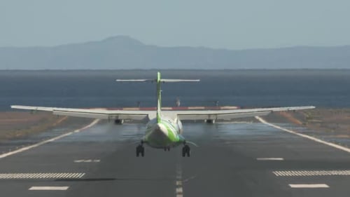 Jetliner Arrival. Airplane Landing on Runway By the Sea