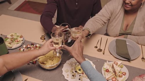 Friends Making a Toast at a Dinner Party