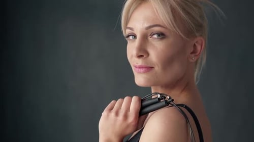 Woman Posing with a Jump Rope