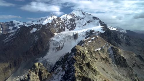 Majestic Snow-Capped Mountains Aerial View