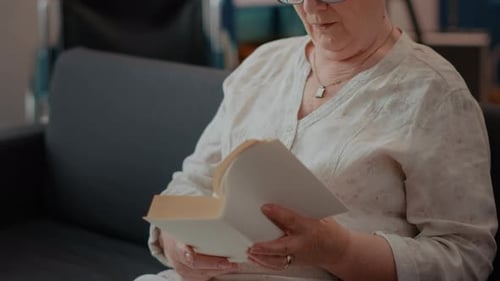 Retired Woman Reading Literature Book for Knowledge