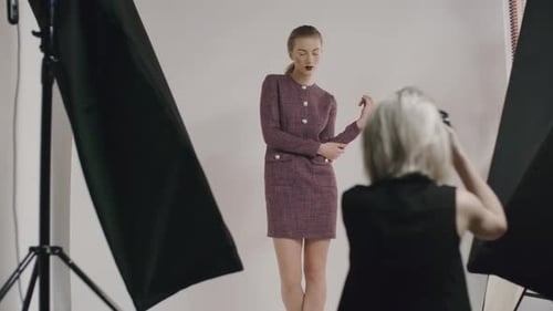 Model Poses for Photographer in Studio with Lighting