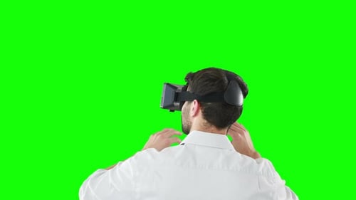 Rear view of man using virtual reality headset