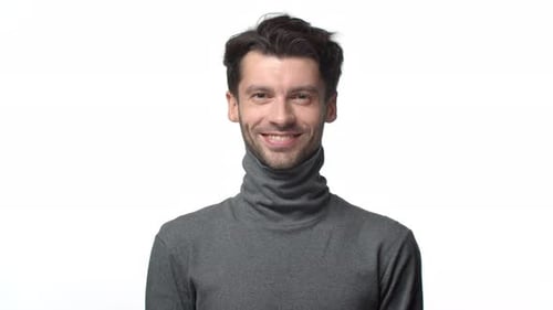 Smiling Young Man With Dark Hair and Beard