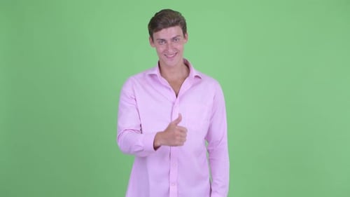 Young Man Gives Thumbs Up Approval Gesture