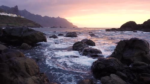 Ocean Waves Crash on Rocks in Sunset Light Playa Benijo Beach Tenerife Canary
