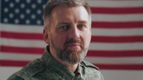 Smiling Man in Military Uniform with US Flag