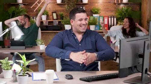 Happy Office Workers are Celebrating a Big Sale