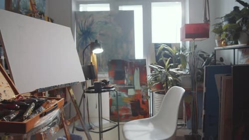 Sunny Artist's Studio with Canvas and Paints