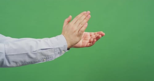 Side view of hands applauding