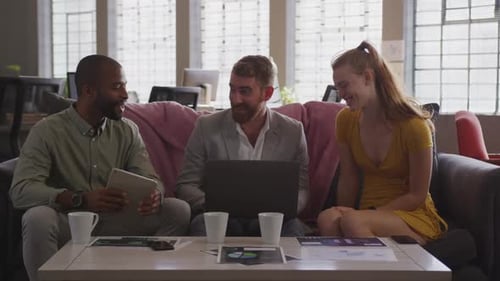 Young creative professionals working in a modern office