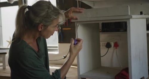 Woman doing DIY at home