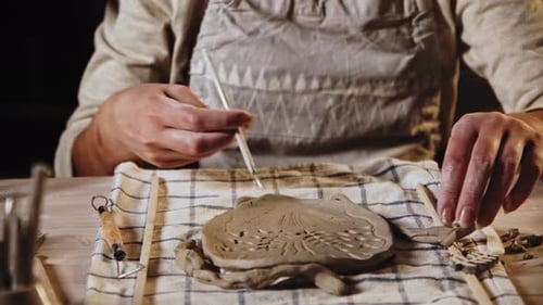 Adult Sculpting Intricate Clay Art Piece