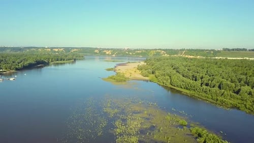 Aerial Flying Over Marshland From the Pier Towards the Urban Landscape