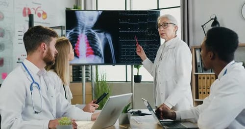 Medical Professionals Analyzing X-Ray Images in Modern Office