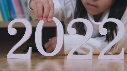 Girl Places Zero to Create 2022 Number