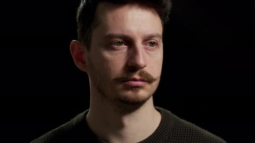 Close Up of a Pensive Man with a Mustache